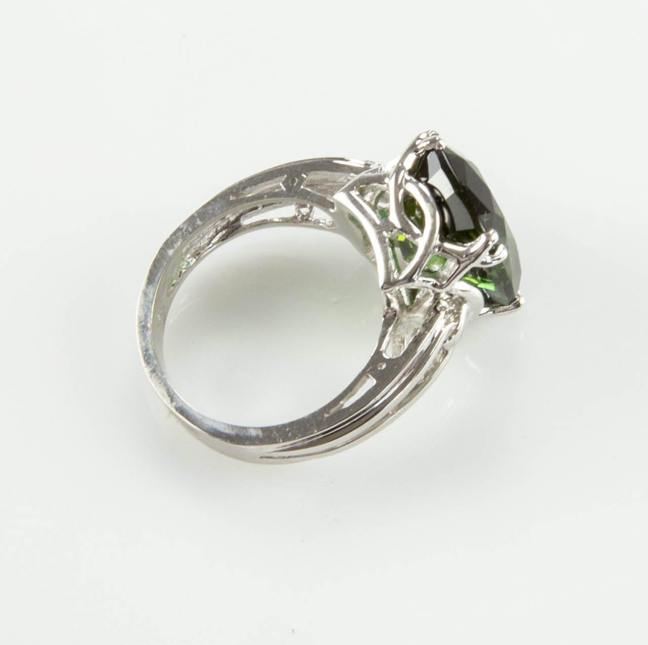Featuring a Cushion-cut Green Tourmaline 8.54ct; beautifully hand crafted in 18k white gold with Classic eight claw mounting with split half-round shank; handmade; 8.39gm. Ring size 7. We offer complimentary ring re-sizing. Classic and simple…Always