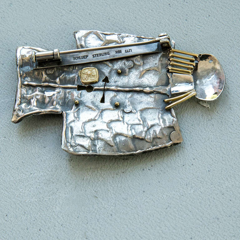 One-of-a-Kind signed Walter Schluep Figural Guardian Angel Pin #A510; 18k and Sterling Silver; approx. size: 2.5” x 1.75” Marked: SCHLUEP STERLING 18K SCHLUEP plus his trademark signature. All handmade and hand hammered; circa: 2010. excellent