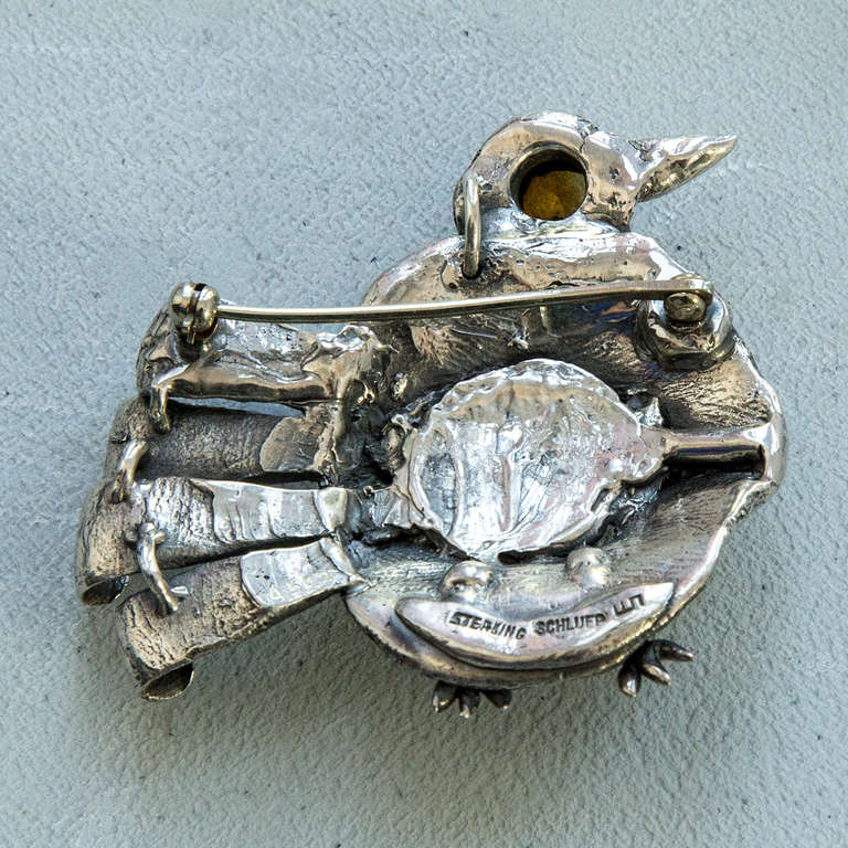 Rare and Edgy Walter Schluep Figural Sterling Silver Bird Brooch Pin with a faceted citrine eye and a woman’s face on his belly! all handmade; Signed: SCHLUEP STERLING and WS his trademark signature. Artist # A502; Approx. total weight of pin: