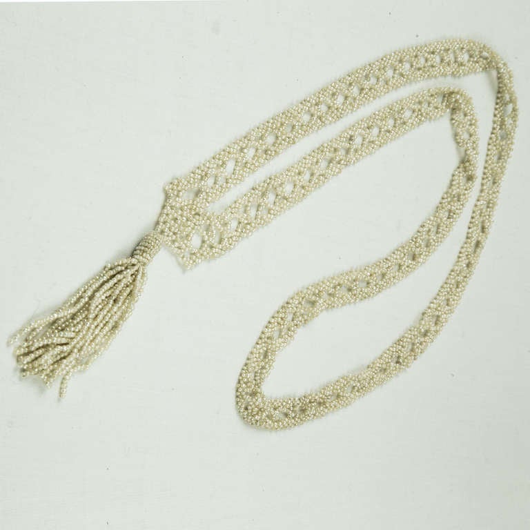  Beautiful Georgian or early Victorian, intricately crocheted, Natural Seed Pearl Necklace with Tassel Drop. The necklace is 32 inches long with a 2.75 inch tassel drop. Delicate but at the same time very wearable, having withstood the test of time!