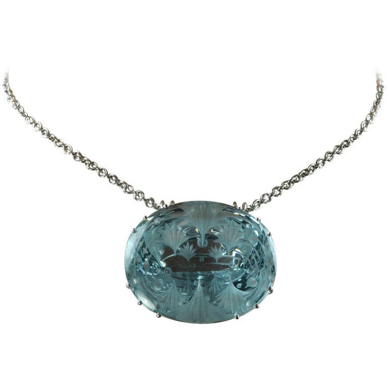260 Carat Engraved Oval Blue Topaz Pendant