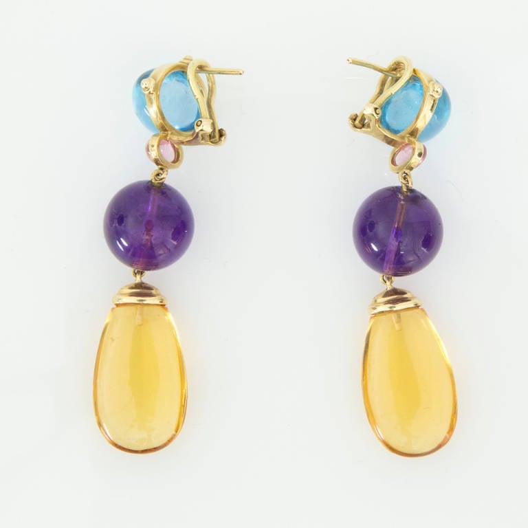 Beautiful Gold Drop Earrings with Cabochon Blue Topaz, Pink Tourmaline, Amethyst and Citrine mounted in a handmade 14k yellow gold gallery setting; approx. 2.25” long. Step out in style, Day or Night!