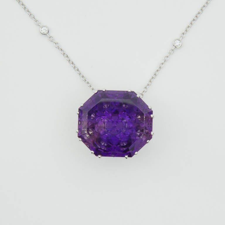 Bold and Beautiful One of a kind Pendant featuring a Fancy Cut Octagon Amethyst, reflecting a multitude of small facet cut amethysts, Wow!!! Approx. weight  and size: 68.2 carat, 27mm x 24mm x 15mm; mounted in a handmade 14k white gold gallery