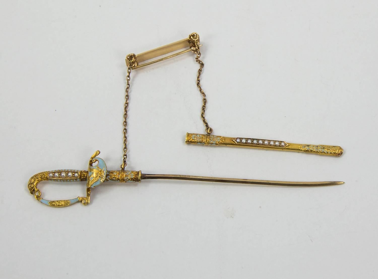 Unique Sword & Sheath Jabot Pin accented with tiny seed Pearls and light blue enamel; tests to 14k yellow gold; C1880s. A must have heirloom for now and forever! 
