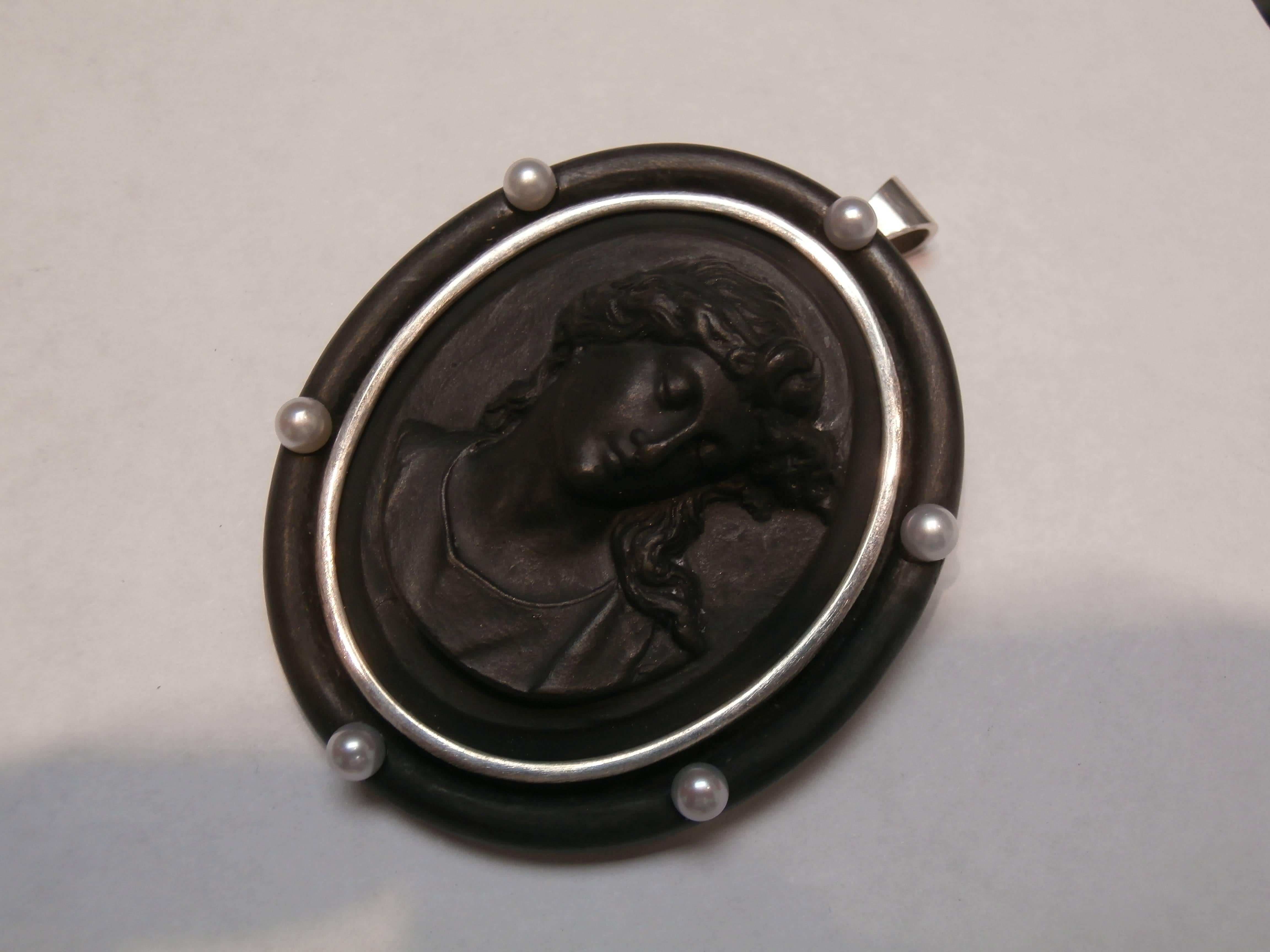 Beautiful and Rare Victorian Black Lava Cameo depicting a Lavish Young Lady, Hand Carved in high relief with fine detailing, her hair, dropping to her neck. Notice the delicate feminine beauty of her face. Set in beautifully hand crafted