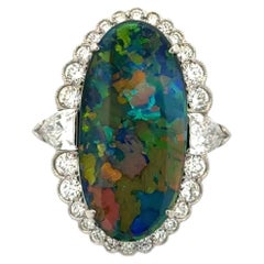 Vintage 7.53 Carat Oval Black Opal and Shield & RBC Diamond Platinum Ring