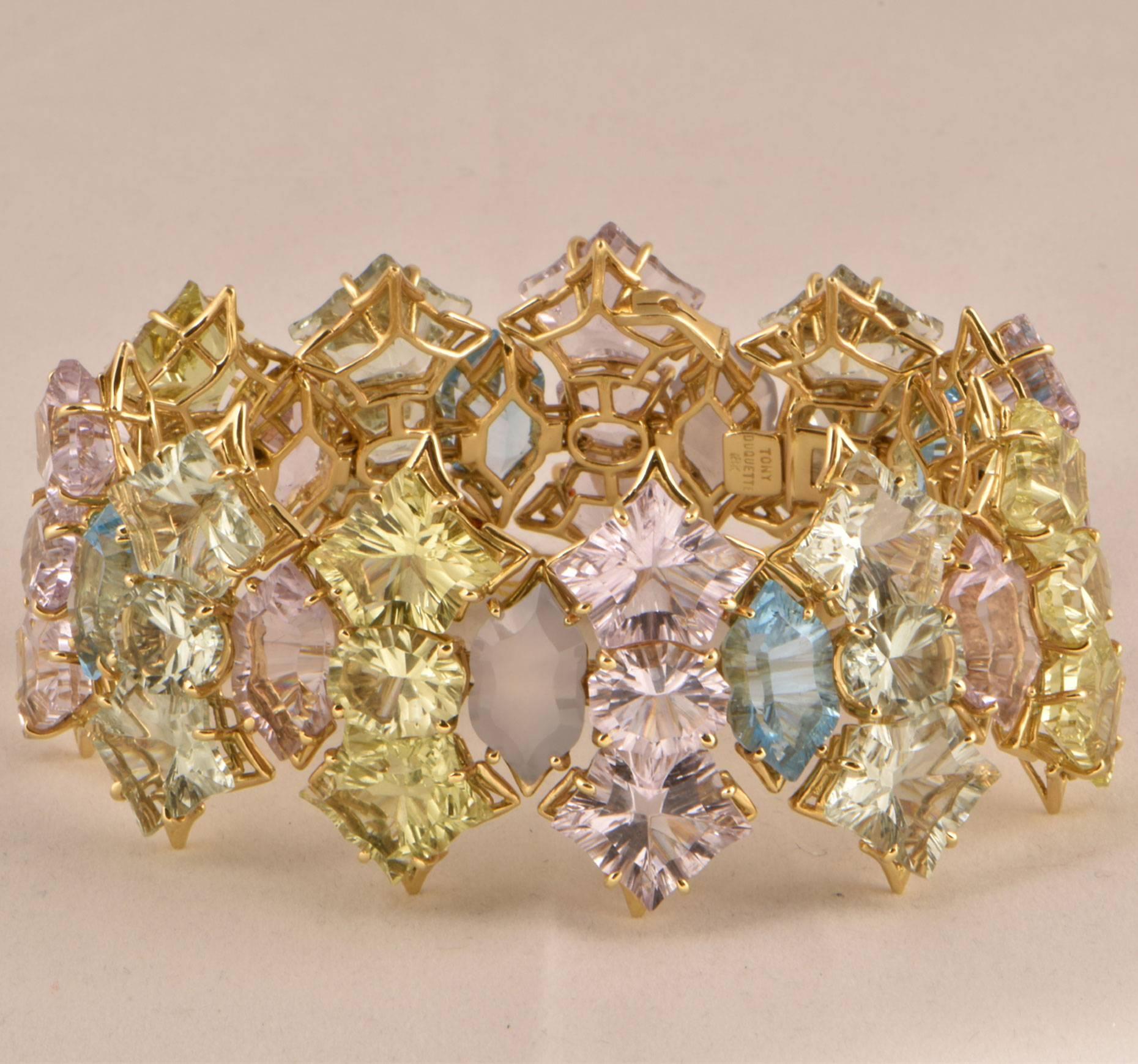 Beautiful Pink (app. 80 ct.), Green Amethyst (app. 62 ct.), Lemon Quartz (app. 47 ct.), Blue Topaz (app. 26 ct.) and Natural Chalcedony (app. 20 ct.) Statement  Gold Bracelet; Signed: TONY DUQUETTE 18K; measuring approx. 8.25