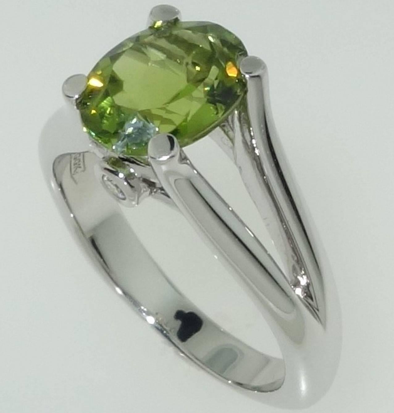 Beautiful Solitaire Ring featuring a 3.01ct Peridot, with 0.06 carat Diamonds set below.  Sterling Silver Rhodium Tarnish-resistant mounting. Size 8. Stylish and Classy…illuminating your look with Timeless Beauty! 
