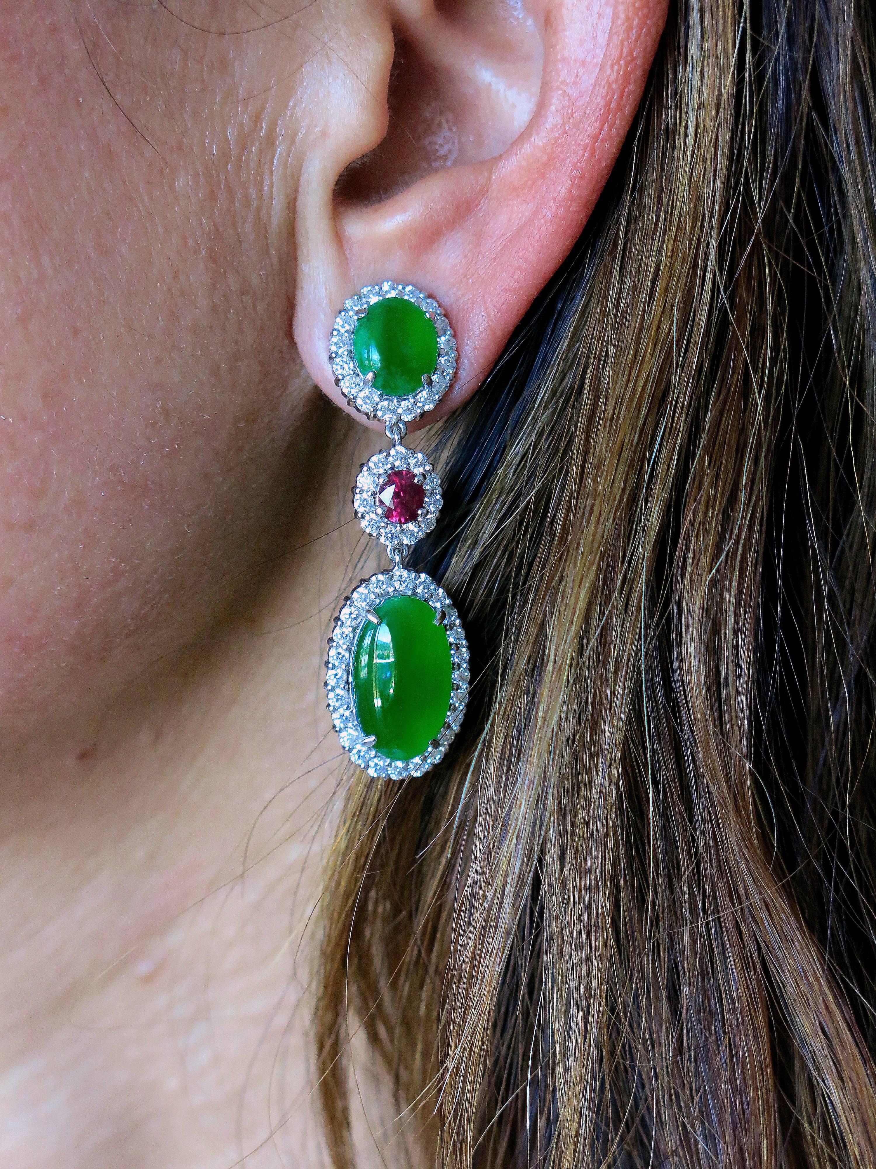 Sensational pair of Dangle Drop earrings set with 2 Jadeite Jade Cabochon Cut measuring approx. 15.8 x 9.5 mm; 5.88 total carat weight and 5.12 total carat weight (A-grade) (N), (certificate GIT); surrounded by 104 round brilliant cut Diamonds;