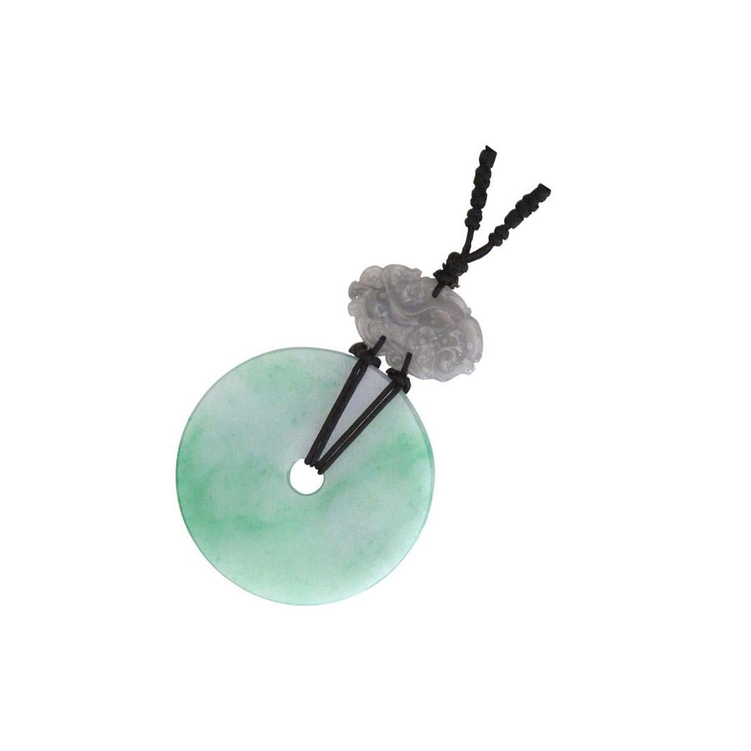 Simply Beautiful! Featuring a Stunning Vintage Hand Carved Jade Disc, enhanced by Diamonds, Sapphires. Hand crafted 18K White Gold Pendant suspended from a Silk cord. Green Jade (A-grade), untreated, 