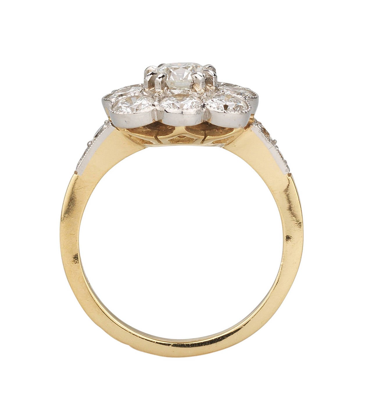 Platinum and yellow gold (18kt) Diamond Ring. Contemporary Antique Style.
French marks.

Total weight of the diamonds: 1.75 carats
In addition the weight of the center diamond: 0.64 carat

Total weight of the ring: 6.5 grams