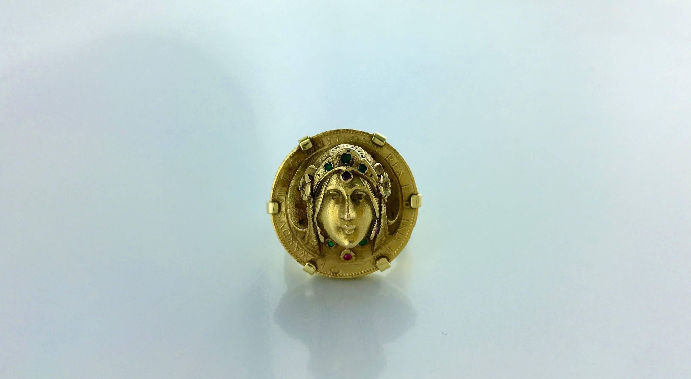 What a Stunning Piece! This Antique High relief Coin illustrating a woman's face surrounded by colored stones is mounted on a post-realised ring in yellow gold 18k 750.
Circa 1960.

Gross weight: 16.96 grams.