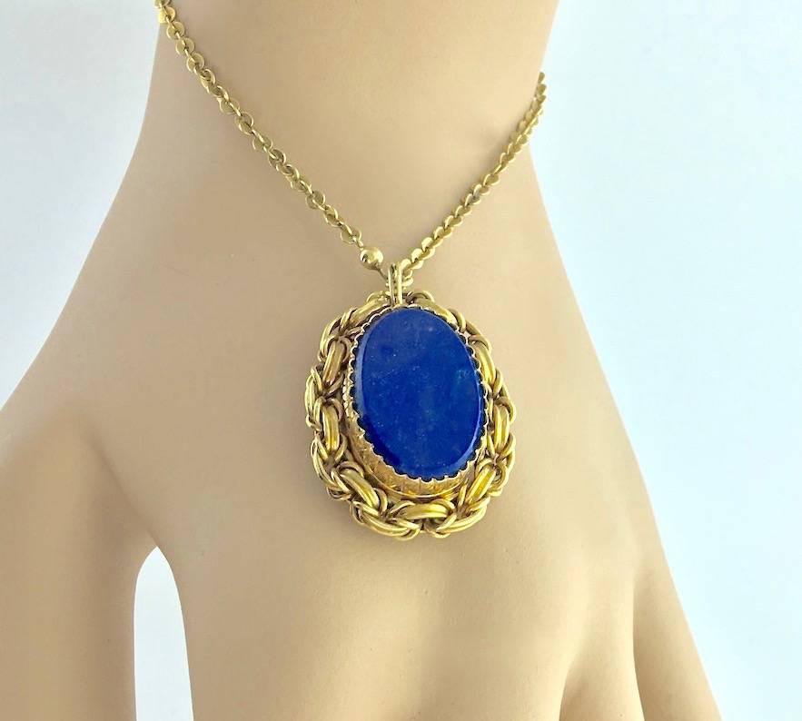 A yellow gold and lapis lazuli Victorian pendant proposed with a chain bracelet. 
Wearable on a necklace.
French work.
XIXth Century.
Oval pendant measures: 3.5x2.5 cm (1.4x1 inches).  
Total weight: 15.94 grams.