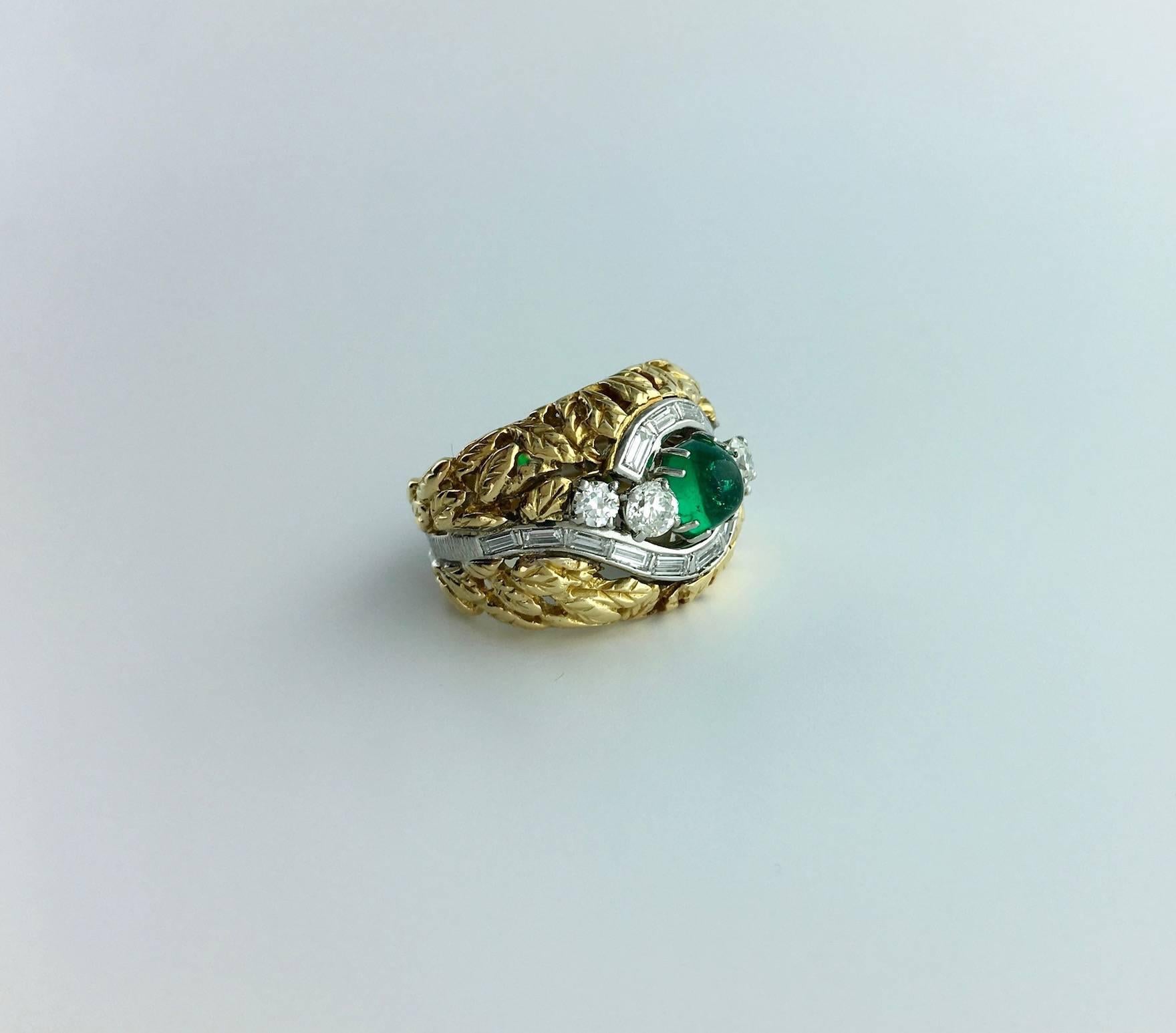 Lovely Floral engraved yellow Gold and Platinum ring with baguette cut and round Diamond (approximately 1.15 carats). In the center a Cabochon Emerald weighting 0.86 carat.
Circa 1970.

Gross weight: 11.86 grams.