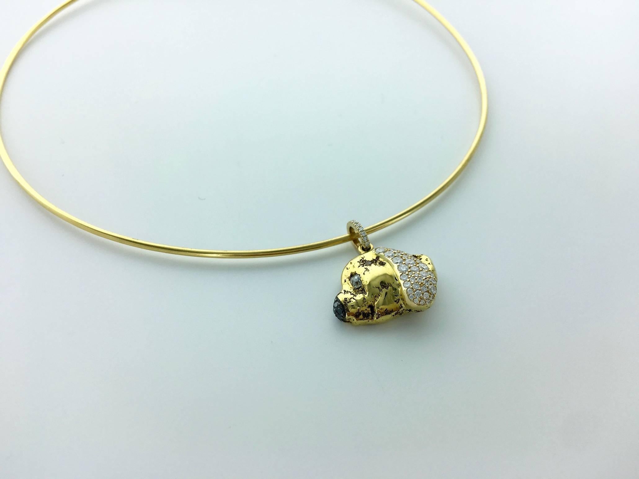 The Necklace is in 18k Yellow Gold and the Lovely Dog's head Pendant is a Gold nugget 22k with white and black Diamond.

Gross weight: 24.50 grams.