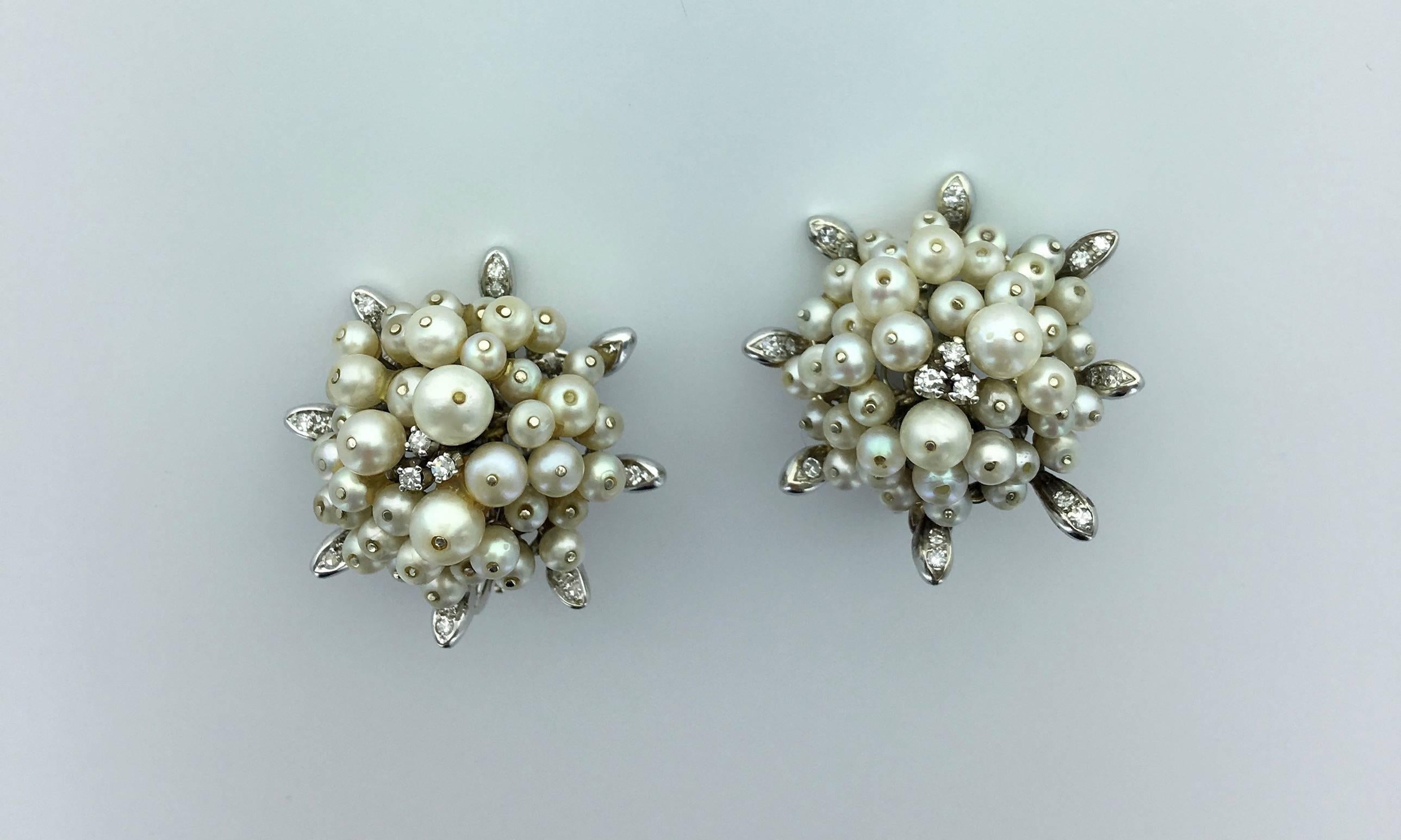 SnowFlakes Earrings reminding the spirit of Coco Chanel. 
Both Natural and Cultured Pearl surrounded by Diamond on White Gold 18k 750.
Circa 1955.

Gross weight: 32.99 grams.