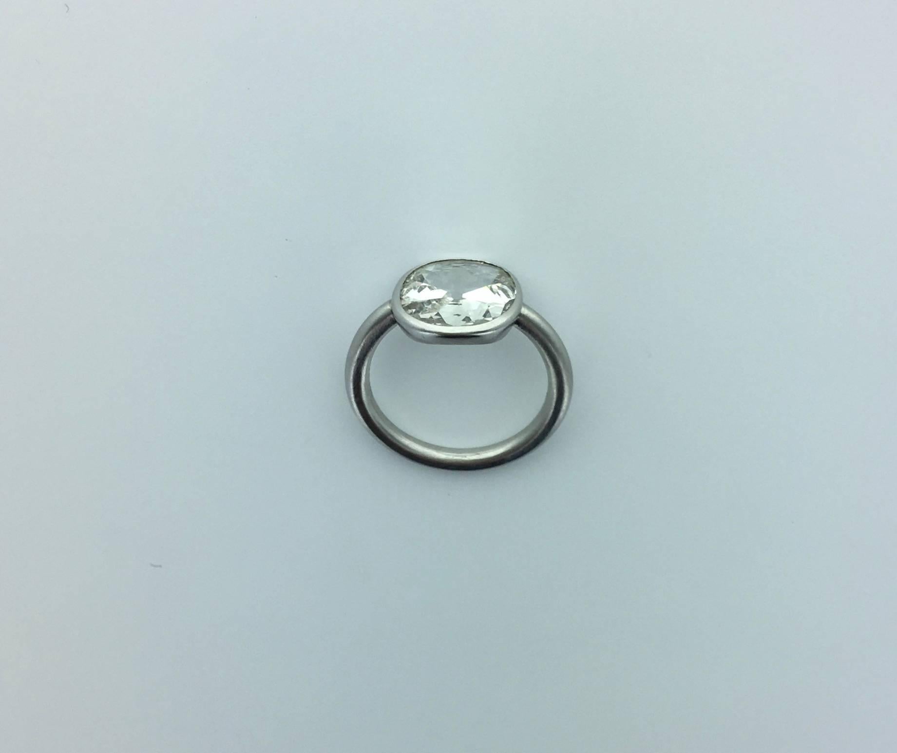 Elegant contrast between Antique and Contemporary this platinum ring is a perfect creation centered by a closed set Old mine cut Diamond very flat of 2.23 carats which has a great spread.
Diamond estimated J-K color and I1 purity.
Swiss