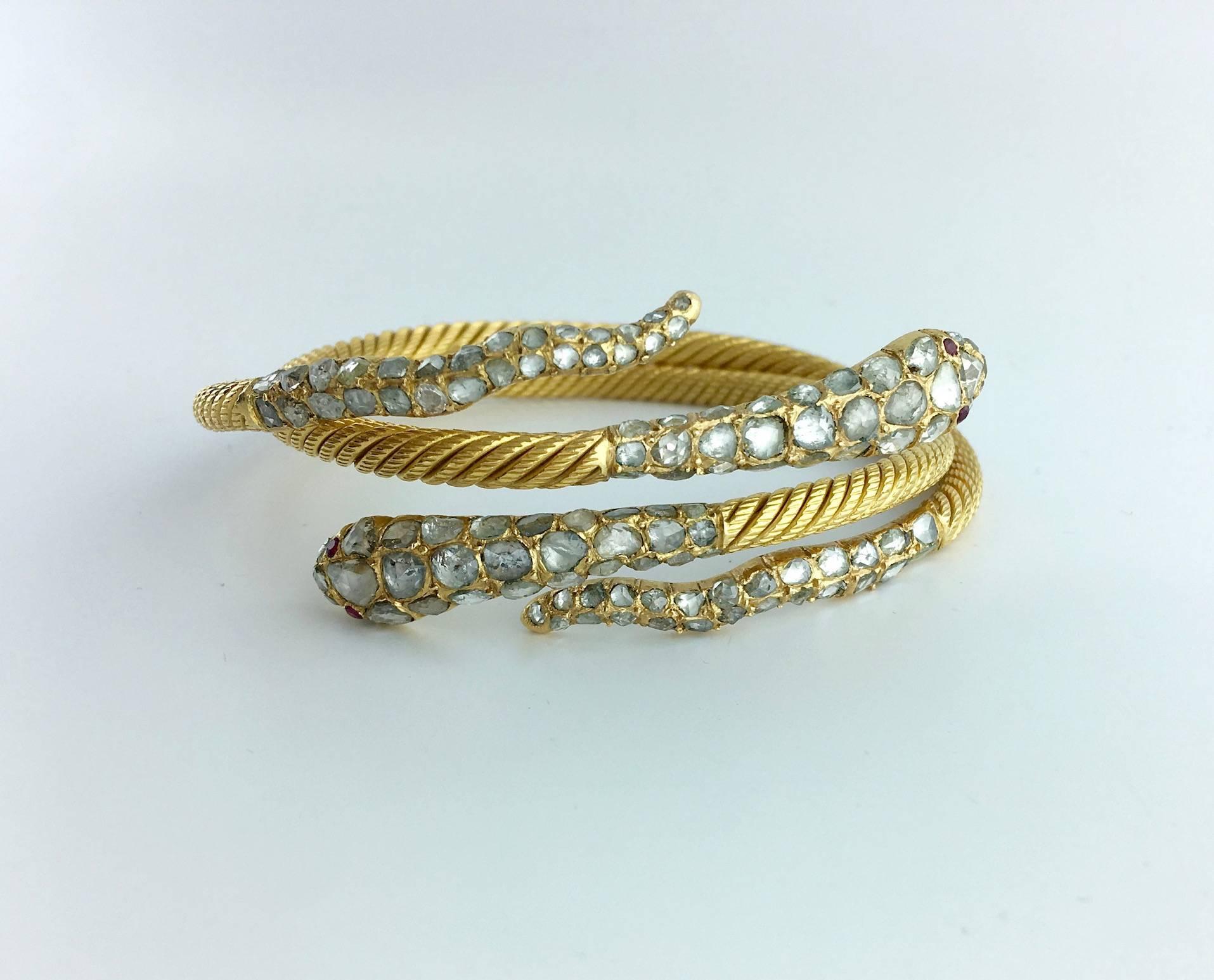 We had a crush (once again) on this pair of Snake Bracelets in yellow gold 22k twisted and set by Rose-cut Diamond (approximately 2.00 carats total). Gathered or worn on each wrist those jewels will increase your Sex-appeal!

Gross weight: 93.69
