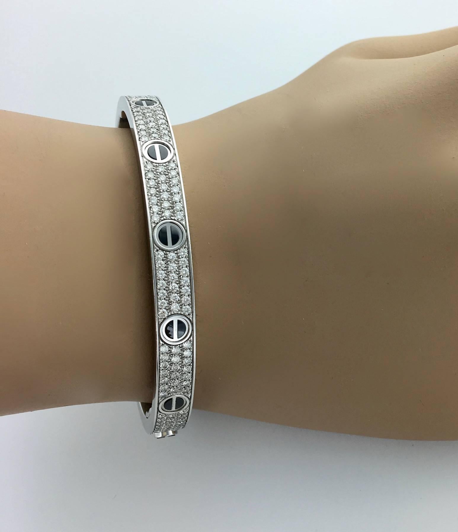 Love bracelet, white gold 18k 750, black ceramic, set with 204 brilliant-cut diamonds totaling 2.18 carats. 
Size 18.  
Signed Cartier and numbered.
