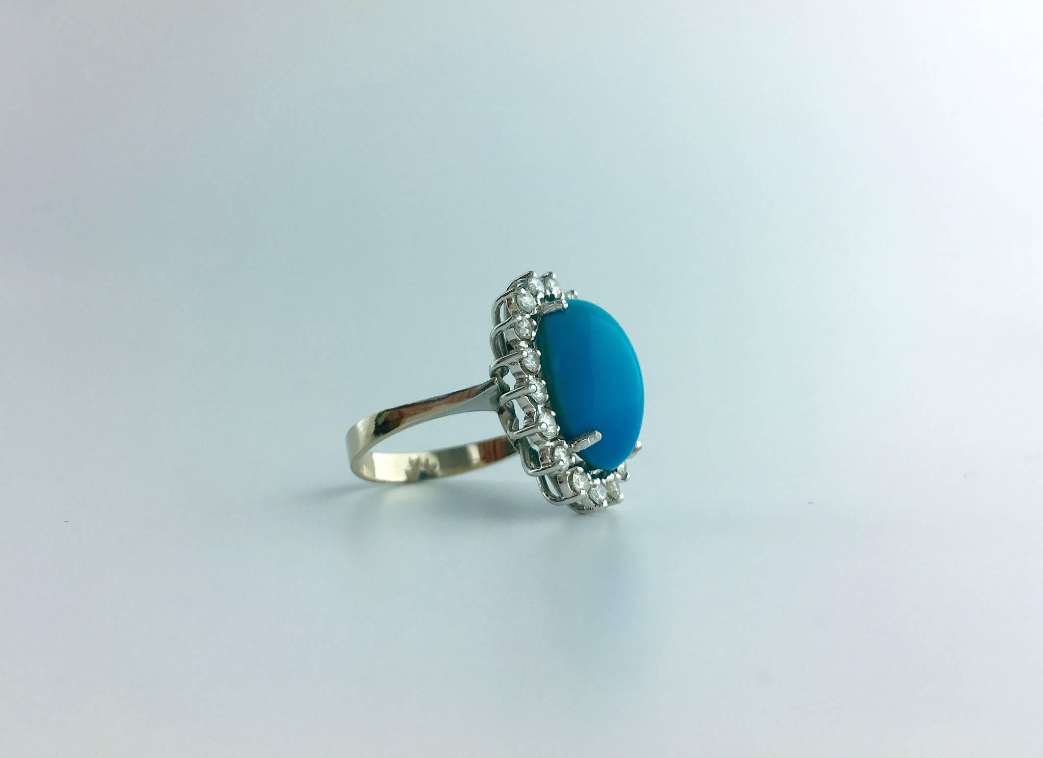 Magnificent Turquoise Natural of a perfect Blue surrounded by Diamond on white gold ring.
Circa 1980.

Size: 8
Can be sized if required.

Gross weight: 8.13 grams