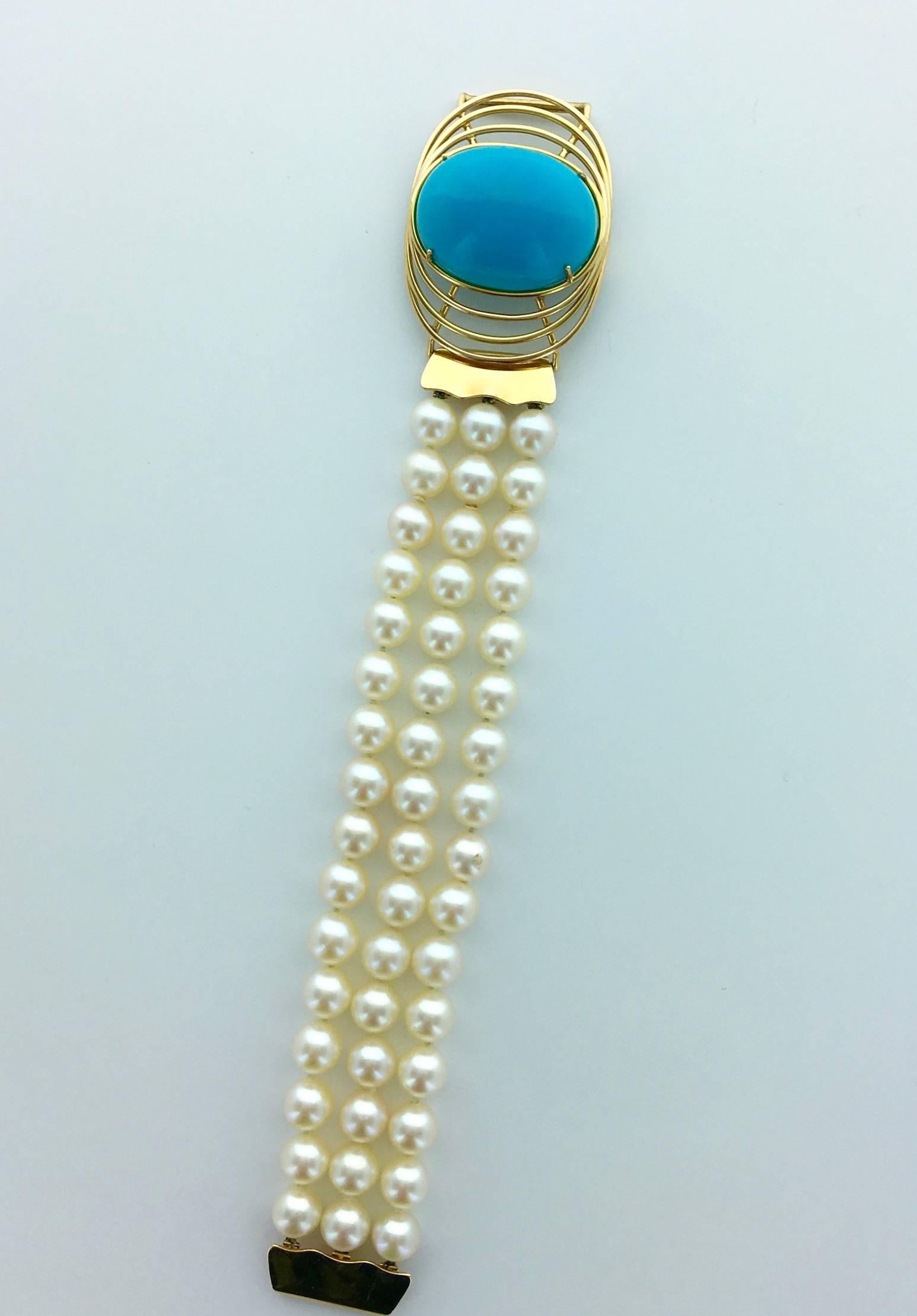 Perfect jewel for this Summer! The Turquoise is Oversized and absolutely perfect. The Blue is deeper than the Greek sky. Centering a yellow gold 18k 750 pattern with three strands of cultured pearls. 
The center can be worm as a pendant on a