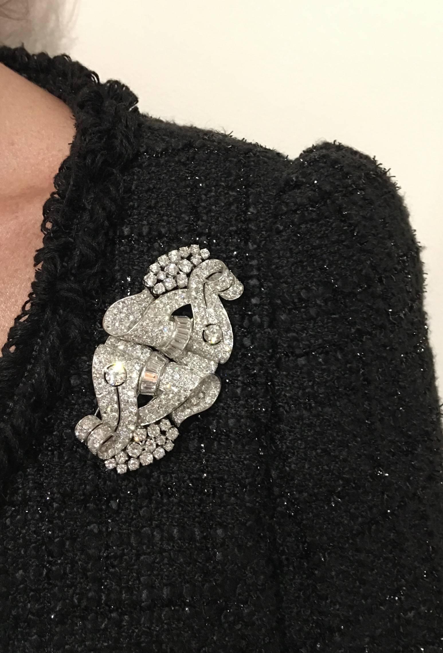 Perfectly designed this impressive clip brooch is convertible in two brooches.
The Diamond are white and clean. The quality of work is very fine.
The Diamond total weight: approximately 18.00 carats.
Circa 1935.

Gross weight: 45.00 grams.