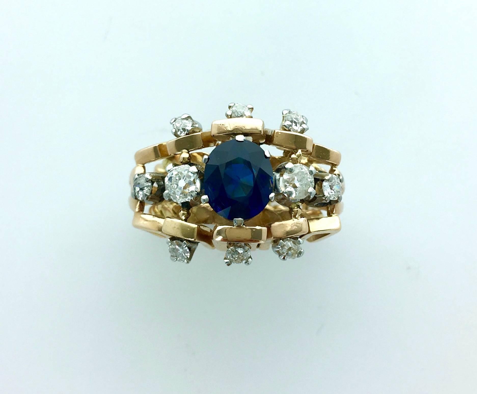 Great creation in pink gold and platinum centered by a natural blue Sapphire surrounded by Diamond.
Circa 1950.

Gross weight: 14.76 grams.