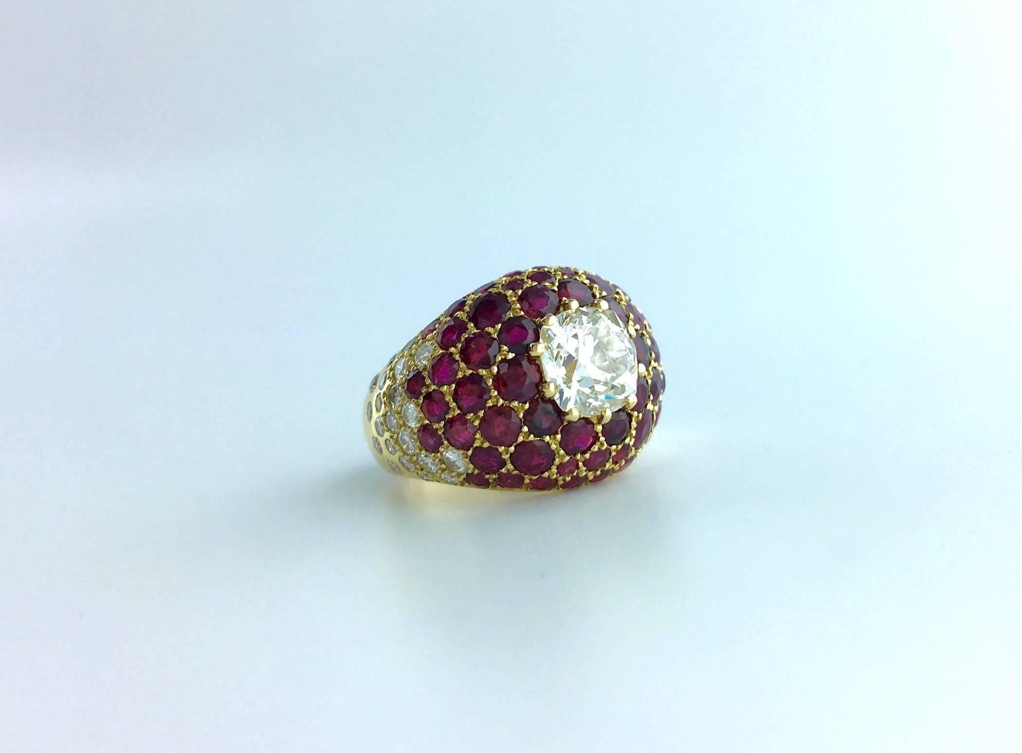 Beautiful realisation by Lorenz Baumer. This contemporary piece made in France is perfectly designed. Centered by a Cushion Old mine cut Diamond eye clean surrounded by ruby pavé and diamond.
French marks.
Signed Lorenz Baumer.