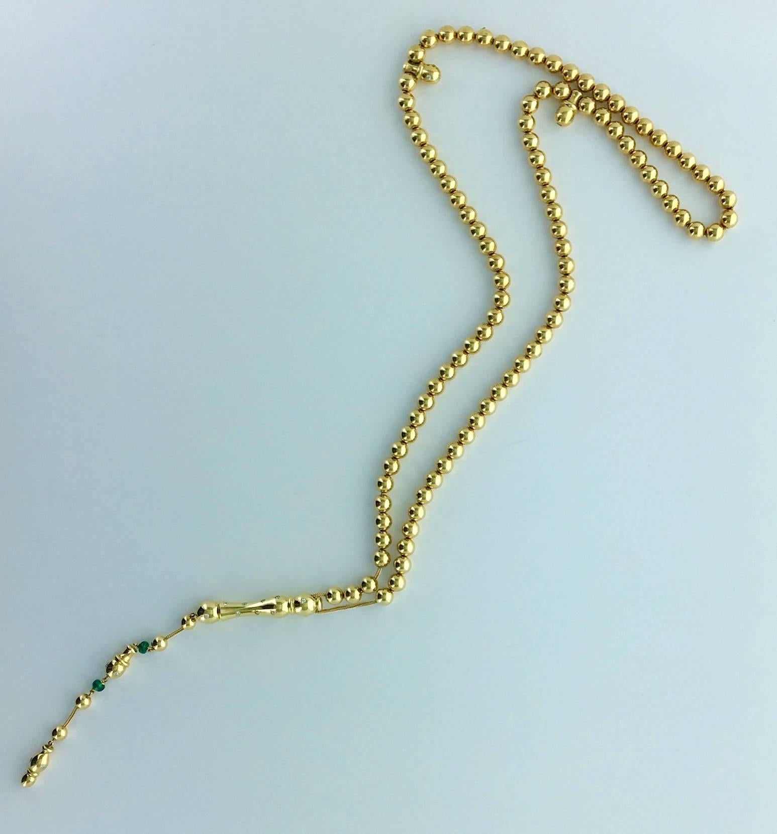 Sautoir Necklace composed by 99 beads in yellow gold, Emerald, White and Fancy Yellow color Diamond.

Circa 1960.