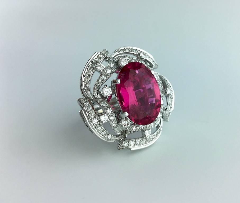 Stunning color this oval Tourmaline Rubellite is gorgeous. 13.15 carat accompanied by a Ssef Swiss Laboratory certificate. Mounted on Diamond and white Gold Ring.