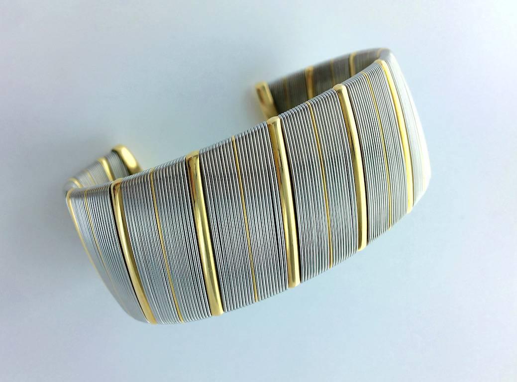 Great piece! We just received and we love it!
Cartier yellow gold 18k and steel Bangle. Circa 1970.
Signed, Numbered and marked.

Gross weight: 63.80 grams.


