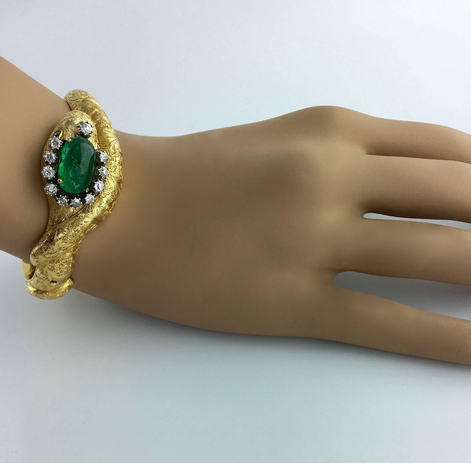Serpent Snake Bangle Mid-19th Century. The head is crowned by a cabochon Emerald (more than 5.00 carats) surrounded by Old mine cut Diamond.

Designed as an interlocking snake, the head highlighted by a cabochon Emerald surrounded by Old mine cut