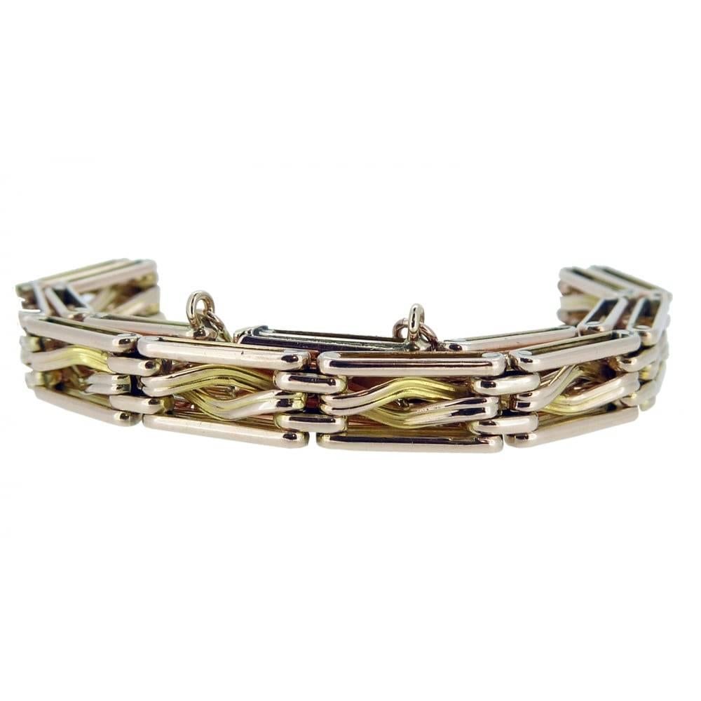 Fancy link gate bracelet in 9ct gold  The inner link is twisted in a semi-rope style whilst the outer edges are plain polished.  Each of the "gates" measure approx. 6.00mm wide x 11.6mm long.  Fastening with a "V" spring catch