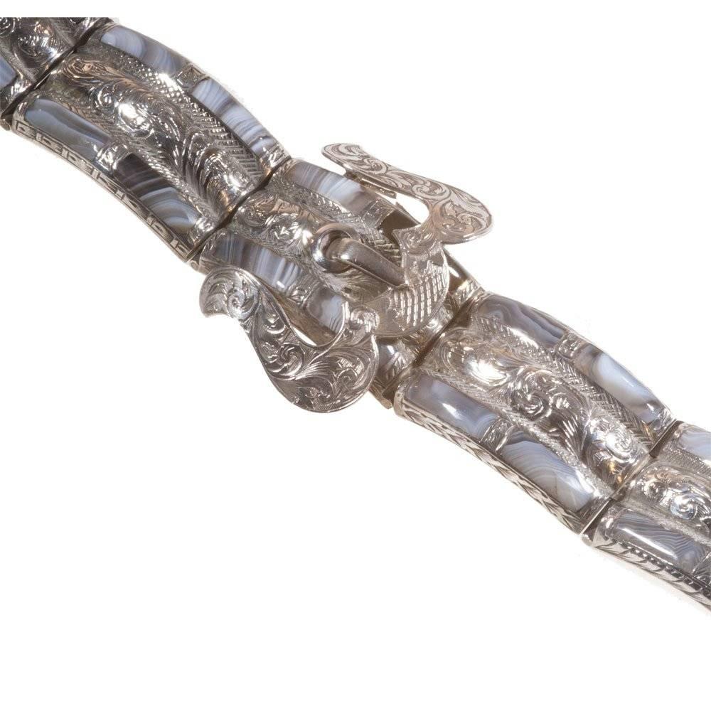 Fabulous Victorian Scottish bracelet set with Cairngorm quartz in subtle shades of grey.  The bracelet comprises interlocking curved sections so that, when fastened, the bracelet becomes rigid just as a bangle would.  The sections are set to the