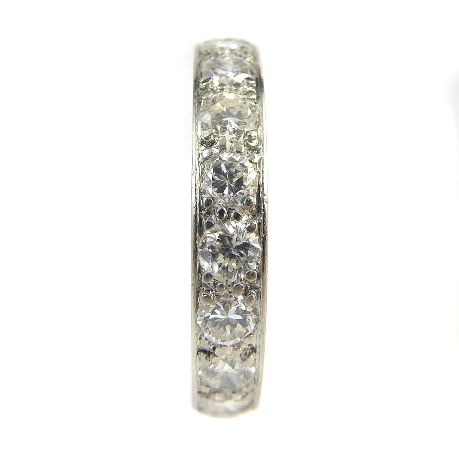     19 x brilliant cut diamonds
    2.8mm diameter each
    1.54ct total
    Assessed G-I colour, VS/SI clarity
    3.5mm wide band
    Tests as platinum
    Finger size 61/4 (US/Canada); M1/2 (UK/Australia)

A diamond set full eternity ring in