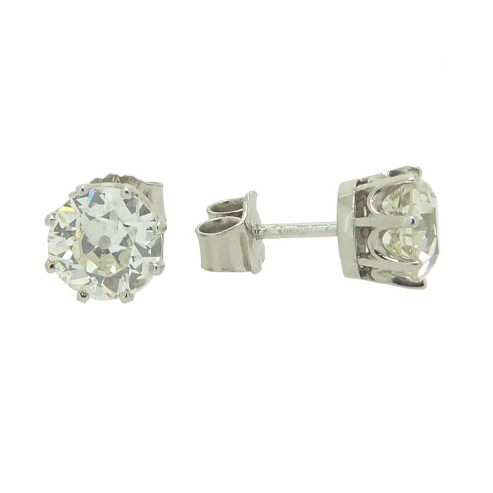     2 x old cut diamonds
    2.82ct total
    Assessed VS1-VS2 clarity, K/L colour
    Platinum settings

A stunning pair of single stone diamond earrings each set with one old European cut diamonds in white coronet settings with post and fittings