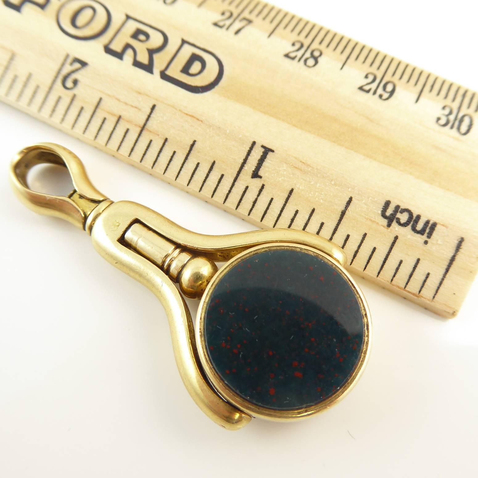 pocket watch with a silver chain and a bloodstone
