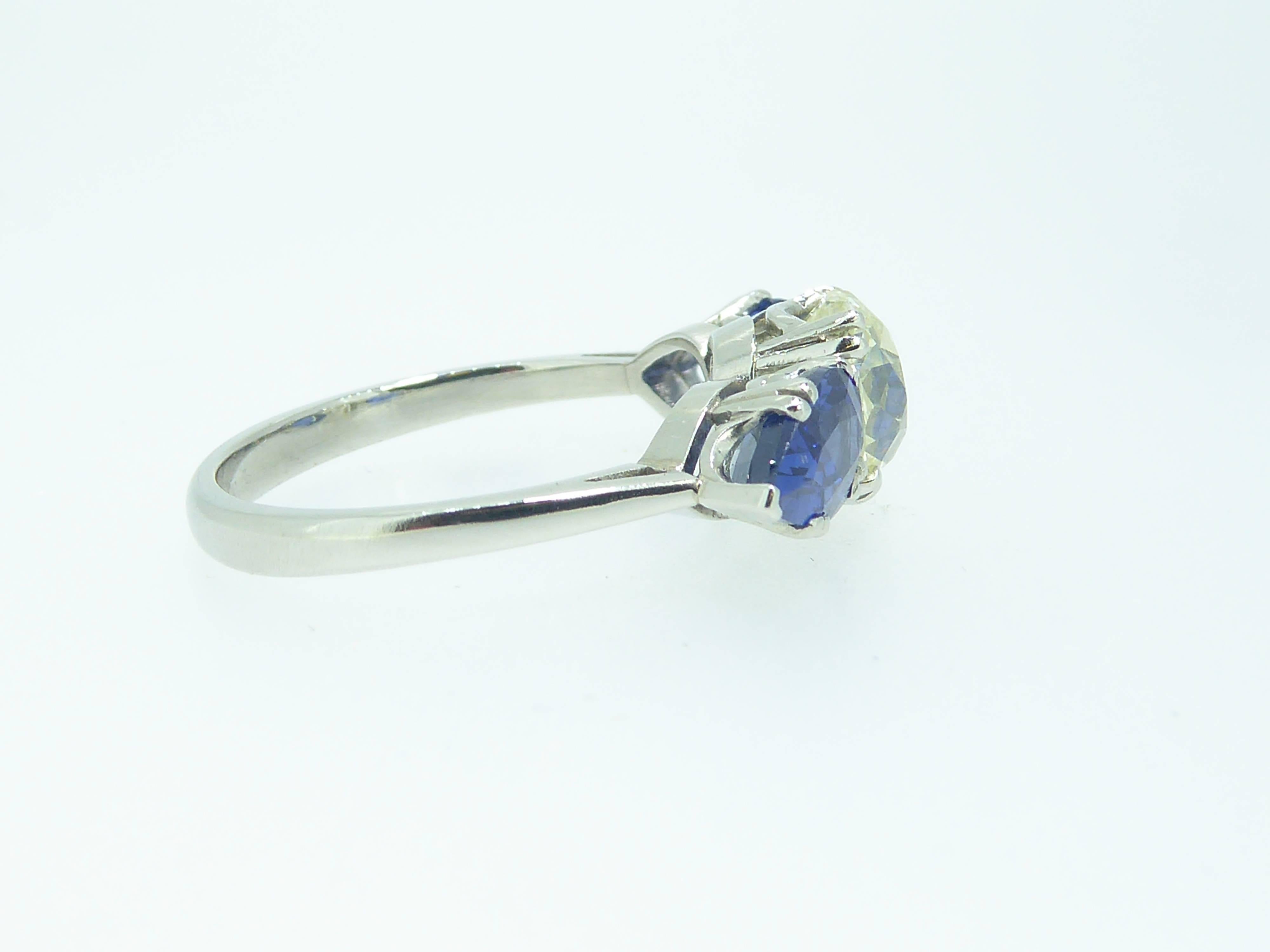 Details
    1 x old cushion cut diamond
    7.22mm x 6.44mm x 5.44mm
    1.90ct
    Assessed colour tinted, clarity VS1-VS2

    2 x pear shaped sapphires
    8.12mm long x 5.20mm wide (approx)
    2.44ct (total weight)
    Colour assessed as Good


