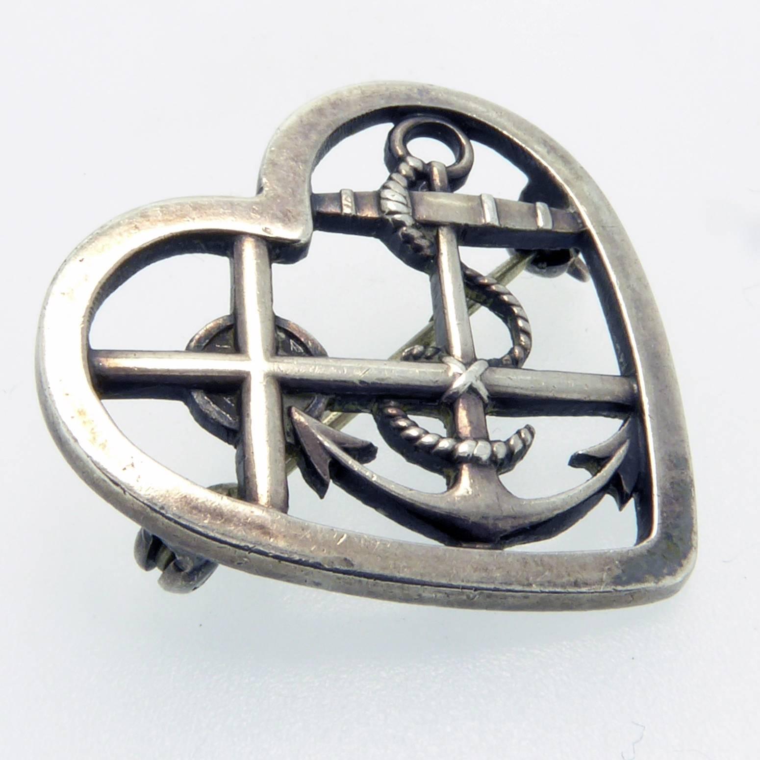 A very pretty vintage silver brooch by the Jensen designer, Wilhelm Albertus and known as design no. 296 Faith, Love, Hope. A rather nice patina has developed over years of careful use making the brooch worthy of adding to any Jensen vintage