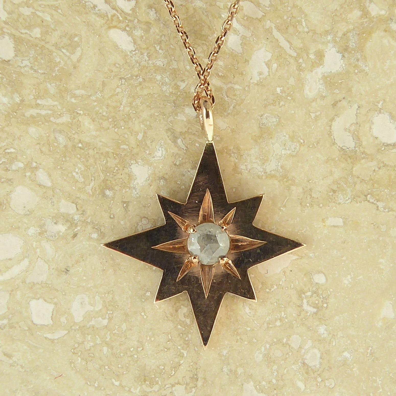 A delightful modern interpretation of a vintage style pendant created in a warm and glowing rose gold.  The pendant is in the form of an eight-pointed star and has been set to the centre with a rose cut diamond in a star shaped setting that