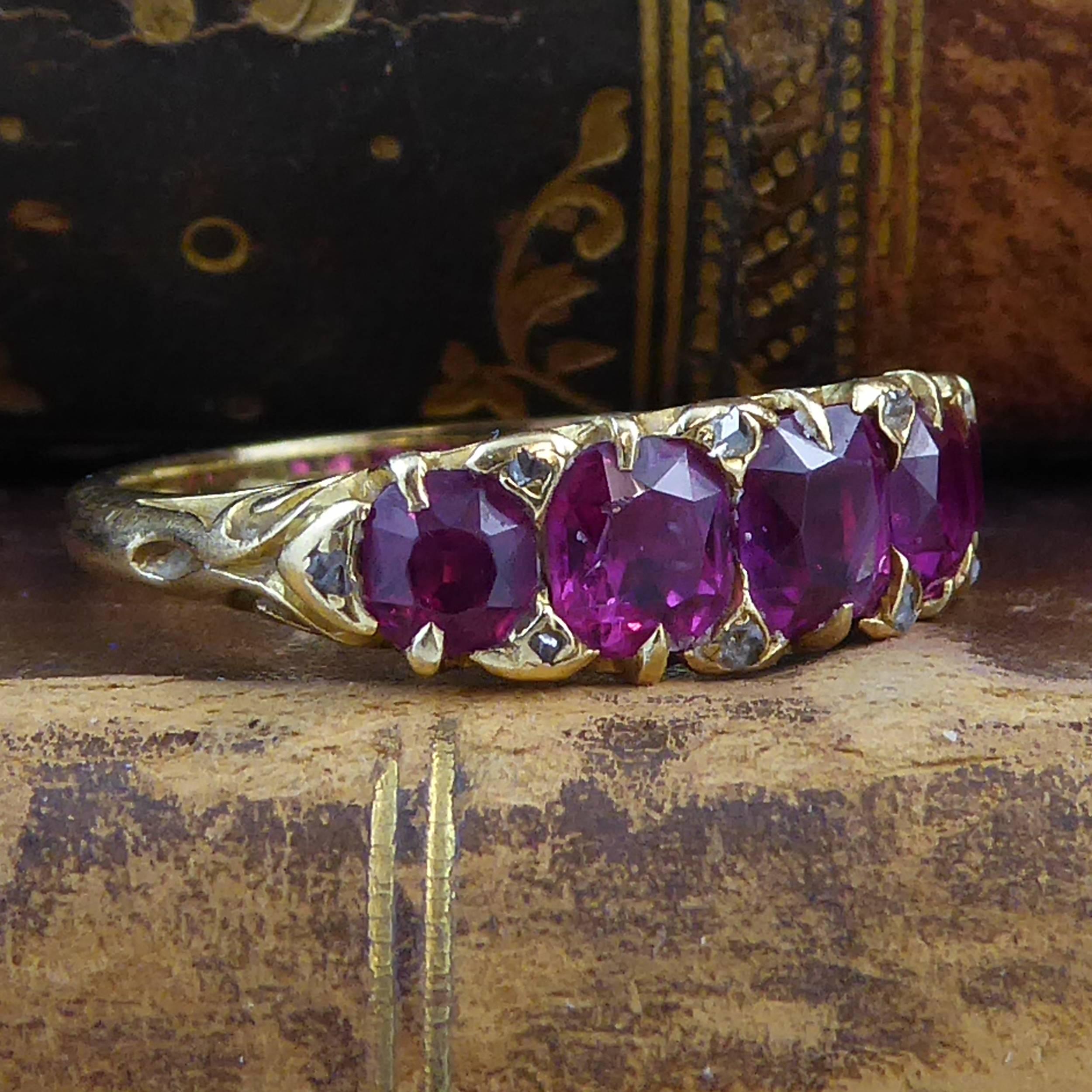 An antique ruby and diamond band from the later part of the Victorian era.  Set with a row of five cushion shaped, mixed cut rubies of medium to dark colour.  The rubies are claw and grain set in a row across the finger and interspersed with 10