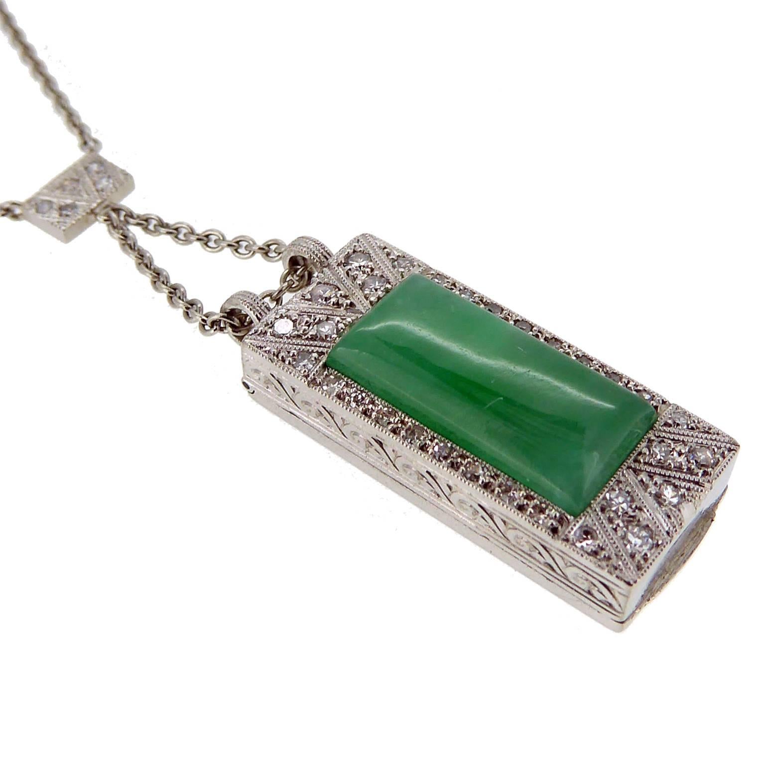 Previously worn as a cocktail watch,  absolutely stunning reworking of an Art Deco Diamond jewel into a very special jade and diamond necklace.  The jade is a cabochon cut cut rectangle, custom cut for the pendant and set within a diamond surround