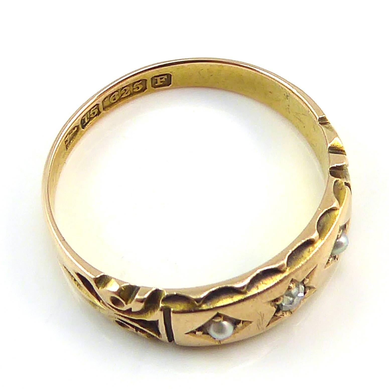     Details

    Victorian era
    Diamond and pearl ring
    Hallmarked 15ct Gold, Chester 1889
    Finger size 7 (US/Canada); O (UK/Australia)
    6.5mm wide approx. max.

 Antique ring from the English Victorian era in 15ct Gold and stamped with