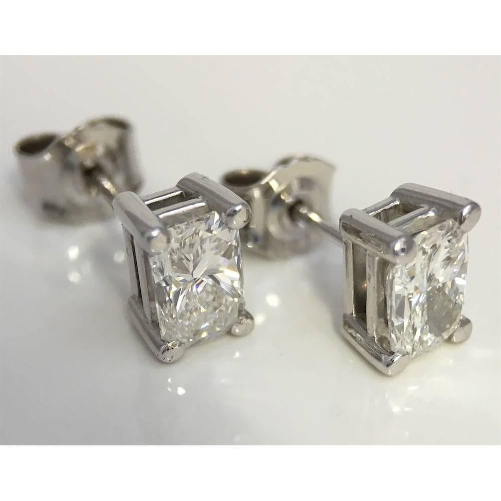 Fabulous diamond solitaire earrings each stud set with a radiant cut diamond measuring approx. 6.60mm x 4.40mm.  Claw settings in 18ct white gold with post and scroll fittings.  Hallmarked 18ct gold at the London Assay Office in 2015.

Details
    2