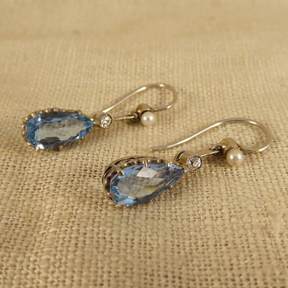 Diamond and Pearl accents add eye-catching sparkle to these Aquamarine Drop Ear Pendants. Crafted in the 1930s in 18ct White Gold, they also come with their original antique box!

Condition: Very Good, slightest signs of wear due to age and