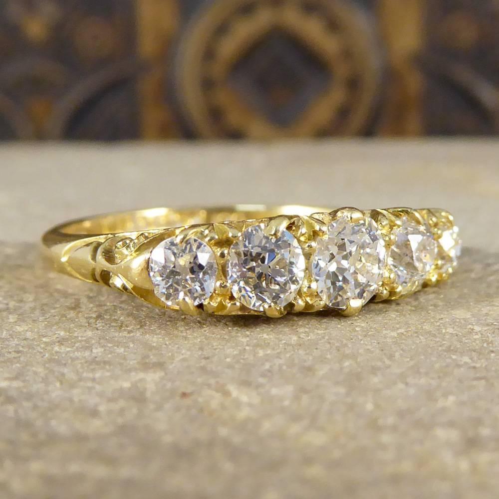 This ring features five old European cut diamonds on a wonderfully detailed gallery design.

Modeled in 18ct yellow gold, it was crafted in the Late Victorian era and looks stately on the hand!

Diamond Details:
Cut: Old European Cut
Carat: approx