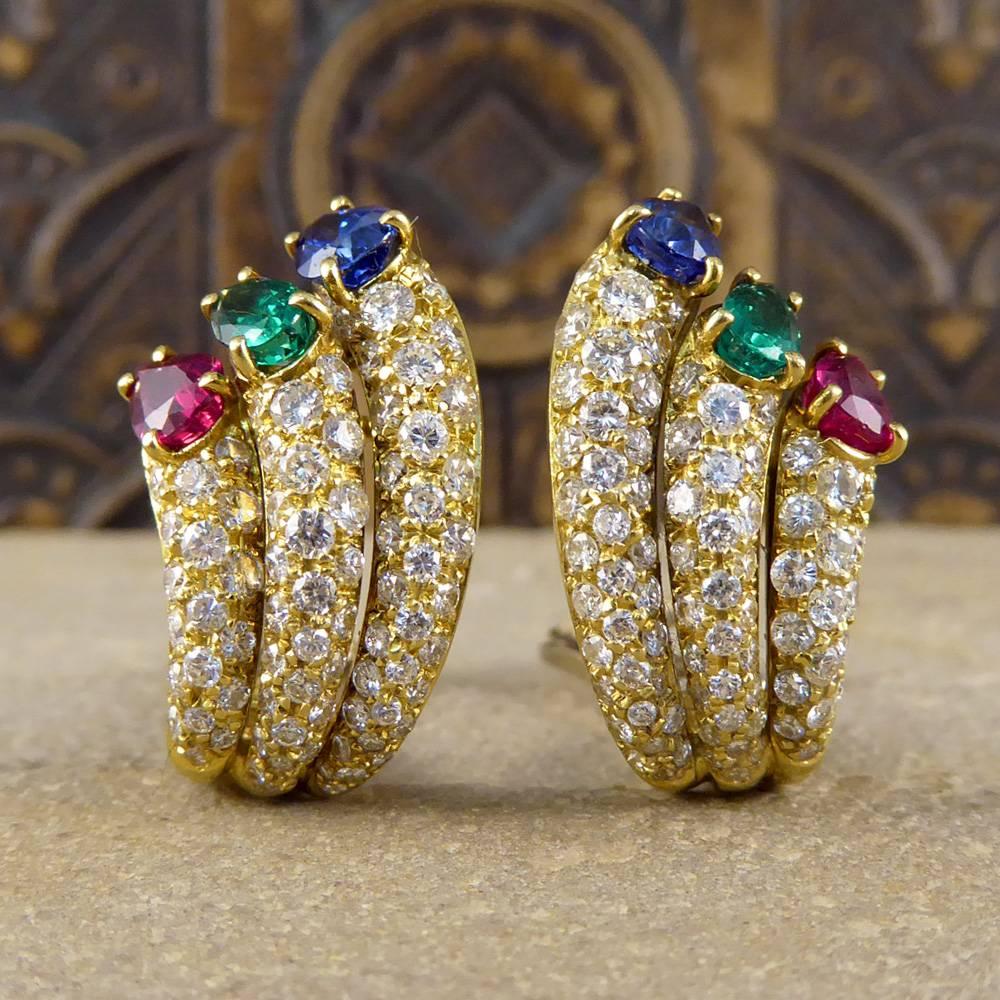 These stunning vintage earrings each feature single ruby, emerald and sapphire stones. With three diamond sprays set in an 18ct yellow gold mount with white gold backs, they dazzle on the ear and will make a standout addition your jewellery