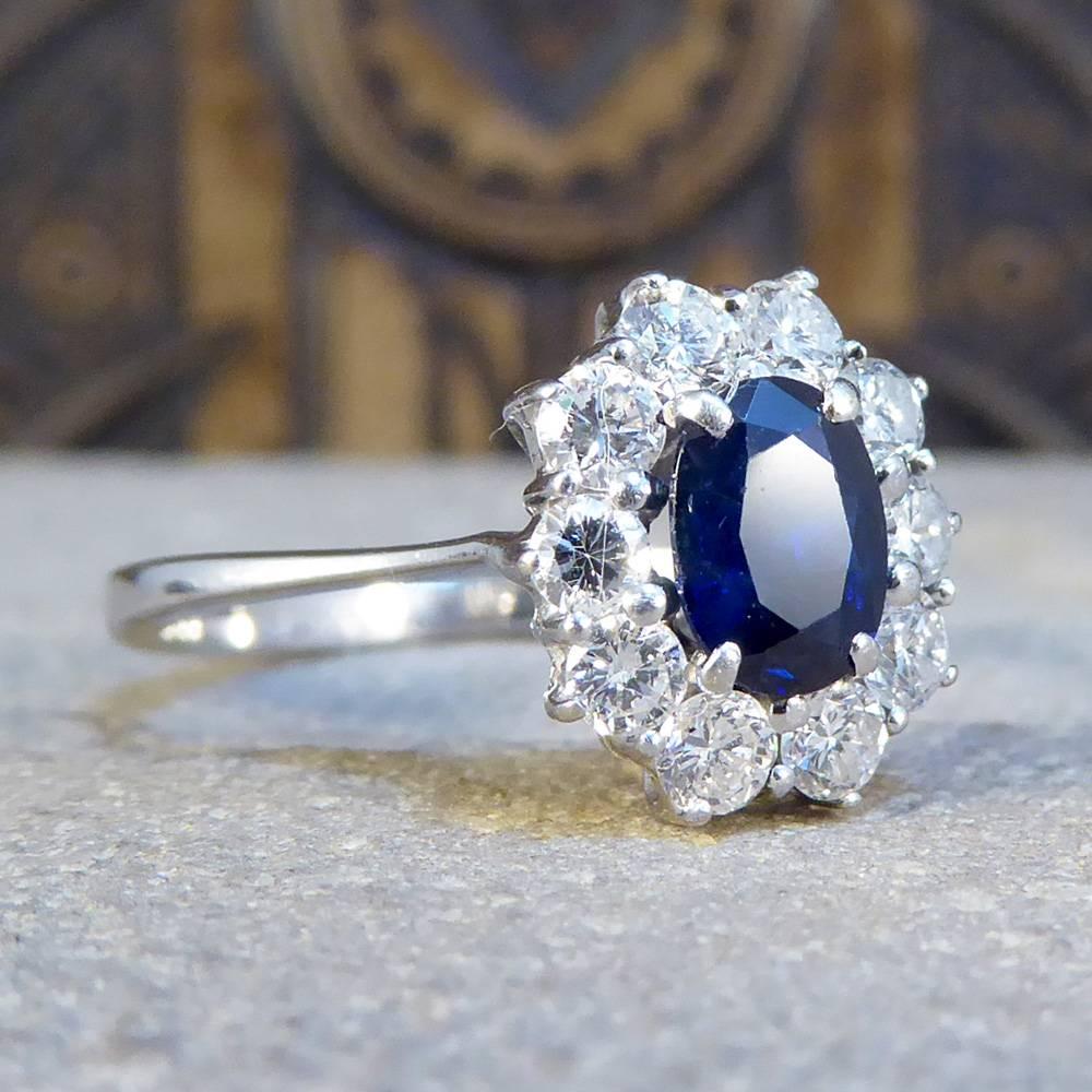 This gorgeous cluster ring features a single 0.75ct blue sapphire stone surrounded by a total of 0.55ct of diamonds. The stones glisten and sparkle in the light, and are slightly raised from the finger with an 18ct white gold setting.

A splendid