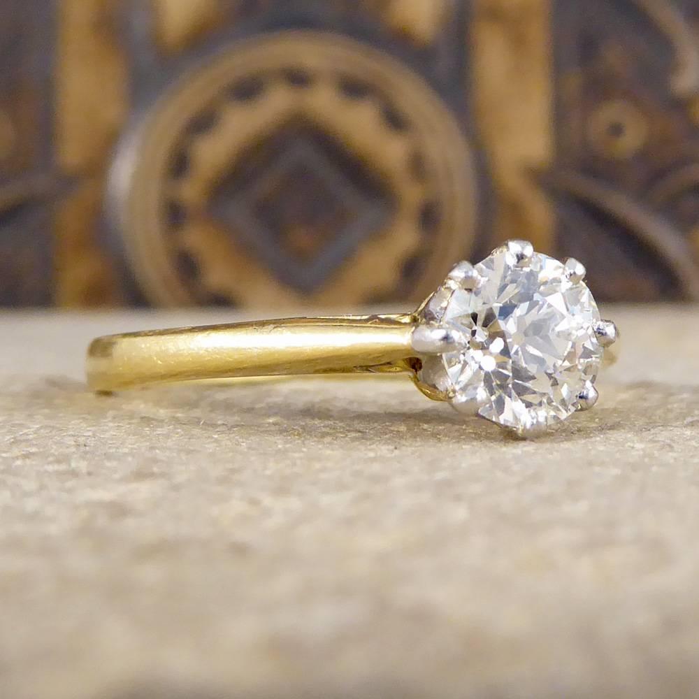 A perfect example of a simple and classic engagement ring. This European Cut Diamond weighs 0.71ct and is claw set with eight 18ct White Gold prongs holding the Diamond securely onto the 18ct Yellow Gold band. A stunning classic engagement ring, how