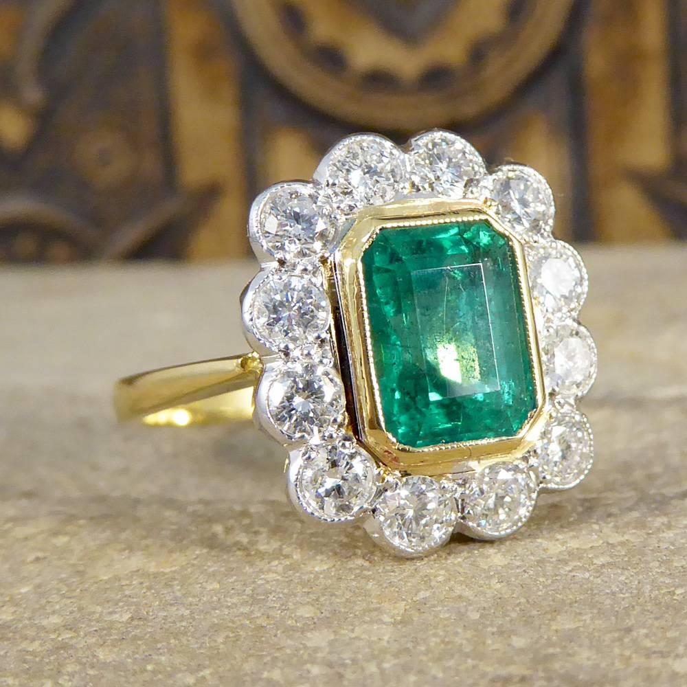 This beautiful Contemporary Emerald and Diamond ring would make the perfect engagement or statement ring. It has been crafted to reflect an Edwardian style Ring, with one single 1.86ct Emerald Cut Emerald in a 18ct Gold rub over collar setting